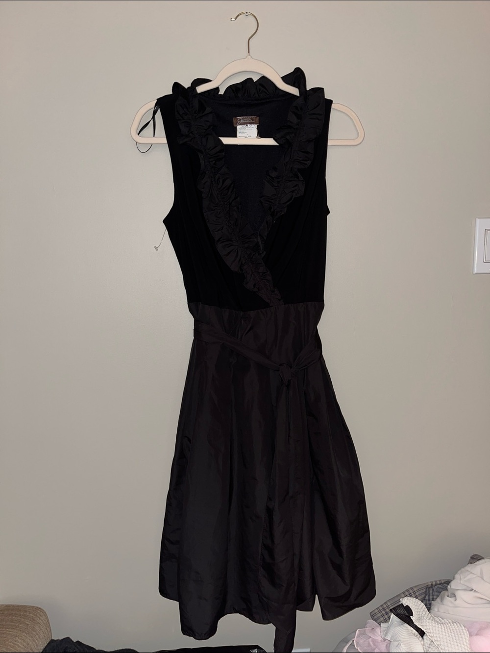The perfect little black dress. Sleeveless Black Ruffle V-Neck Dress